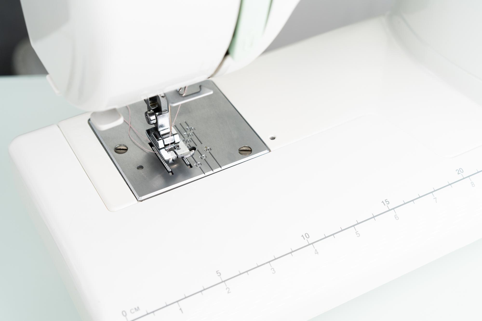 Close-up of high-tech embroidery machine stitching a geometric pattern